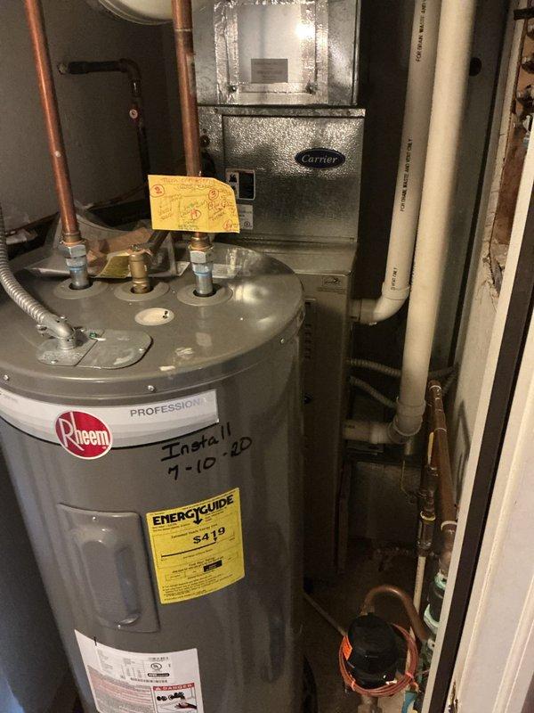 Responded to no-cooling call on 18-year-old air conditioning system. Performed diagnostic evaluation of outdoor condenser unit and indoor air handler. Documented current system condition with photographs for replacement equipment quote preparation. Unit accessed via second floor side entrance.