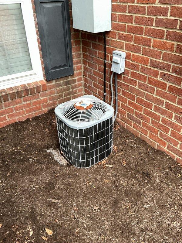 Responded to no-cooling call on 18-year-old air conditioning system. Performed diagnostic evaluation of outdoor condenser unit and indoor air handler. Documented current system condition with photographs for replacement equipment quote preparation. Unit accessed via second floor side entrance.