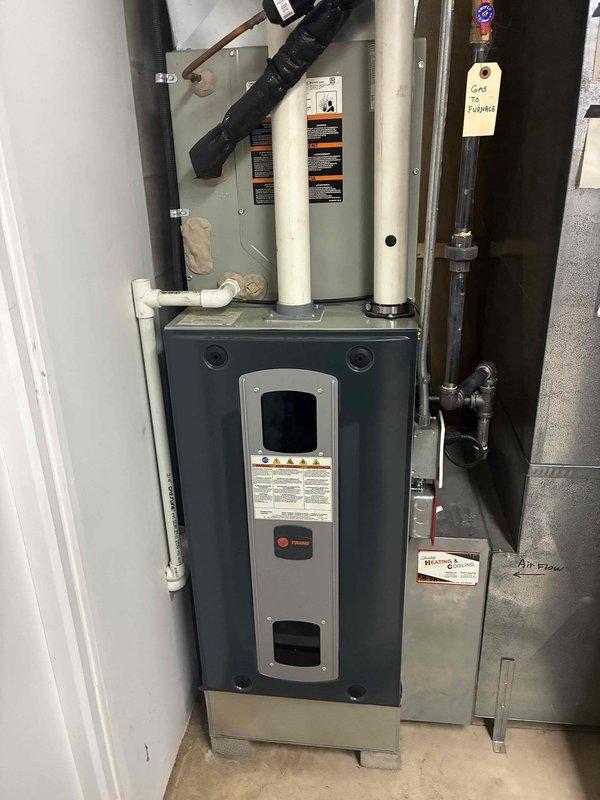 Completed comprehensive AC tune-up on Trane air handler system. Performed standard preventive maintenance including inspection of evaporator coil channels, verification of proper airflow through baffle system, and assessment of refrigerant lines and condensate drainage components. All systems found operating within normal parameters with routine dust accumulation noted in air handler interior.