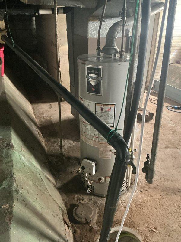 Conducted on-site evaluation of existing conventional tank-style water heater in basement mechanical room to provide estimate for tankless water heater installation. Assessed current plumbing configuration, including copper supply lines, venting system, and electrical panel capacity. Documented existing equipment specifications and utility connections to determine requirements for tankless unit conversion, including necessary modifications to gas lines, water supply piping, electrical service, and exhaust venting system.