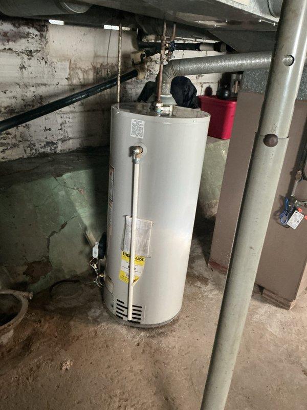 Conducted on-site evaluation of existing conventional tank-style water heater in basement mechanical room to provide estimate for tankless water heater installation. Assessed current plumbing configuration, including copper supply lines, venting system, and electrical panel capacity. Documented existing equipment specifications and utility connections to determine requirements for tankless unit conversion, including necessary modifications to gas lines, water supply piping, electrical service, and exhaust venting system.