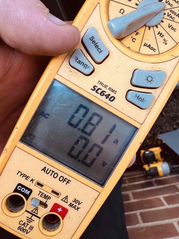 Responded to service call for 3-year-old air conditioning unit making loud thumping noise. Upon arrival, performed diagnostic inspection of indoor HVAC components including capacitor, electrical connections, and wiring harness. Utilized digital multimeter to test electrical readings and verify proper voltage levels throughout the system. All electrical connections were found secure with proper wire management via zip ties. Capacitor tested within normal operating parameters. System components including terminal blocks and conduit connections inspected and confirmed properly installed. Documented equipment condition with photographs for service records.