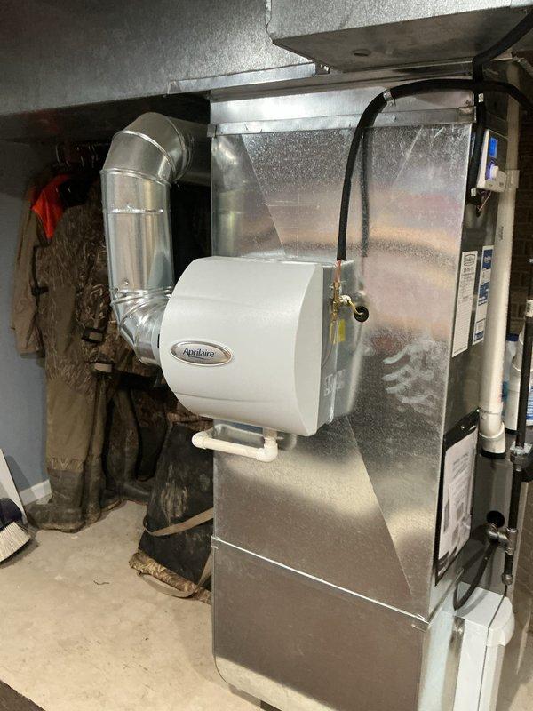 Completed annual MVP cooling maintenance visit on 11-year-old residential HVAC system. Performed comprehensive inspection of furnace, air handler, and associated components including Aprilaire humidifier, ductwork connections, and condensate drainage system. All equipment photographed and documented, with unit found to be operating within normal parameters and no immediate service concerns identified.