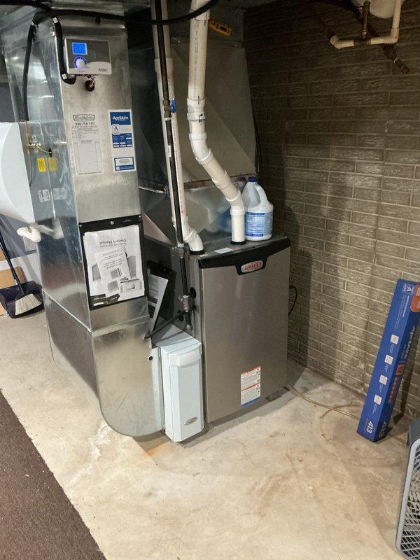 Completed annual MVP cooling maintenance visit on 11-year-old residential HVAC system. Performed comprehensive inspection of furnace, air handler, and associated components including Aprilaire humidifier, ductwork connections, and condensate drainage system. All equipment photographed and documented, with unit found to be operating within normal parameters and no immediate service concerns identified.