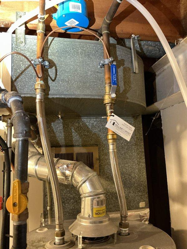Responded to service call for slow draining toilet. Upon inspection, assessed plumbing drainage system from basement access point to identify cause of reduced flow. Examined waste line connections, floor joists, and drainage piping beneath fixture. Inspected water supply system and associated plumbing infrastructure to rule out secondary issues affecting toilet performance. Documented existing plumbing configuration including waste stack, supply lines, and mechanical connections for service records.