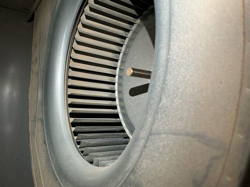 Completed comprehensive tune-up on 6-year-old air conditioning system. Inspected blower wheel assembly, noting dust accumulation on blades and housing; cleaned and verified proper operation. Tested dual-run capacitor with Surephon 440V unit showing proper connections across all terminals; confirmed electrical specifications within manufacturer tolerances and secure mounting bracket installation.