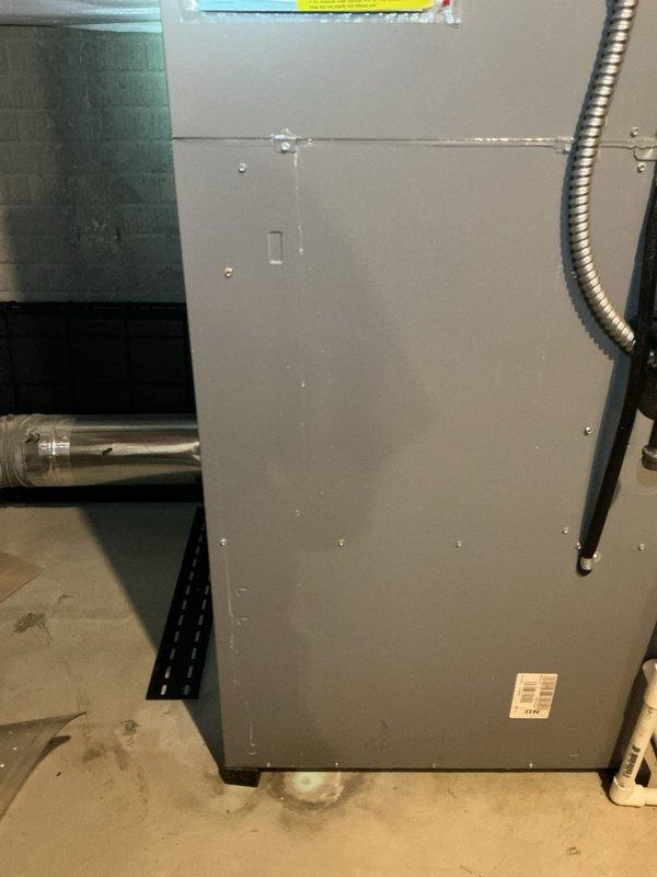Provided complimentary second opinion assessment on 15-year-old air conditioning system. Documented corrosion present beneath furnace unit and moisture accumulation on utility room floor, with photographic evidence captured for customer records and comparison with previous service quotes.
