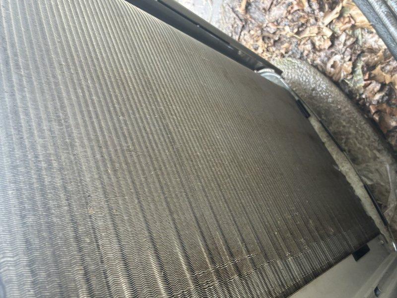 Completed comprehensive AC tune-up on Blind and Sons outdoor condensing unit of unknown age with no reported operational issues. Performed standard maintenance protocol including system inspection, which revealed moderate dirt and debris accumulation on condenser coil fins and evaporator coil assembly with visible dust buildup and discoloration on heat transfer surfaces. Documented equipment condition through photographic evidence showing fin surface contamination and outdoor unit requiring cleaning attention for optimal heat exchange efficiency.