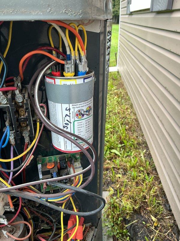 Performed comprehensive tune-up on outdoor heat pump unit. Opened access panel and inspected all electrical components including capacitor, contactor, and control board connections. Verified proper wire terminations and component functionality, documented system condition with photos, and closed unit securely upon completion.