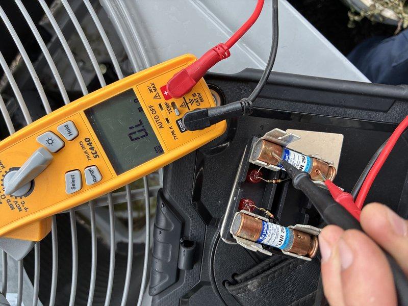 # HVAC Service - A/C

Responded to no-cooling call for 3-year-old outdoor condensing unit that failed to start. Performed electrical diagnostics using digital multimeter to test voltage and continuity at the contactor and dual run capacitor. Testing revealed failed capacitor with 0.0 reading, preventing compressor and condenser fan motor from starting. Replaced defective dual run capacitor, verified proper voltage supply to unit, and confirmed system startup with compressor and fan motor operating normally.