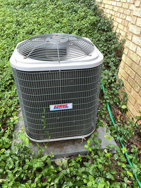 Completed routine air conditioning tune-up and system inspection on residential cooling unit. Performed comprehensive maintenance including electrical disconnect inspection, condenser examination, and operational testing. Noted vegetation overgrowth around outdoor condenser unit and damaged protective cover on electrical disconnect box requiring attention for optimal system performance and safety compliance.
