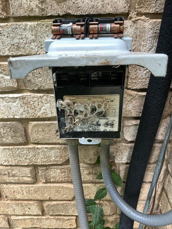 Completed routine air conditioning tune-up and system inspection on residential cooling unit. Performed comprehensive maintenance including electrical disconnect inspection, condenser examination, and operational testing. Noted vegetation overgrowth around outdoor condenser unit and damaged protective cover on electrical disconnect box requiring attention for optimal system performance and safety compliance.