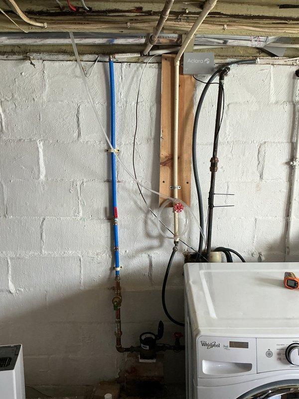 Responded to service call for recurring breaker trips and reported burning smell. Performed diagnostic testing of electrical panel using digital multimeter, confirming voltage readings at 124.2V and inspecting all circuit breaker connections and wiring terminations. Identified disorganized wiring conditions within panel and inspected basement utility area electrical connections serving washing machine and associated appliances to isolate the source of the electrical fault and eliminate the safety hazard.