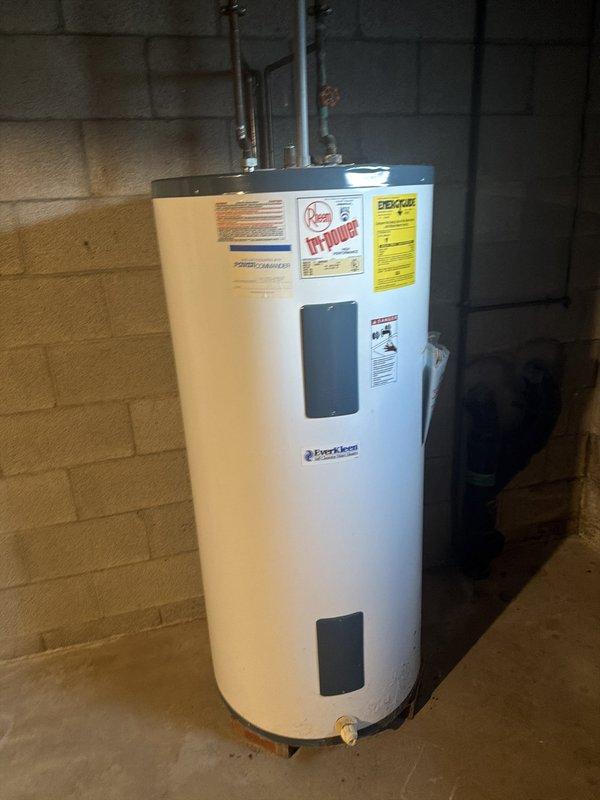 Conducted on-site assessment of existing water treatment system and provided quote for new water softener installation. Evaluated current setup including Wellmate pressure tank, existing water softener with electronic control head, and Rheem water heater to determine optimal configuration for replacement system. Documented equipment conditions and plumbing connections to prepare comprehensive proposal for upgraded water softening solution.