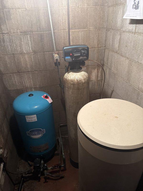 Conducted on-site assessment of existing water treatment system and provided quote for new water softener installation. Evaluated current setup including Wellmate pressure tank, existing water softener with electronic control head, and Rheem water heater to determine optimal configuration for replacement system. Documented equipment conditions and plumbing connections to prepare comprehensive proposal for upgraded water softening solution.