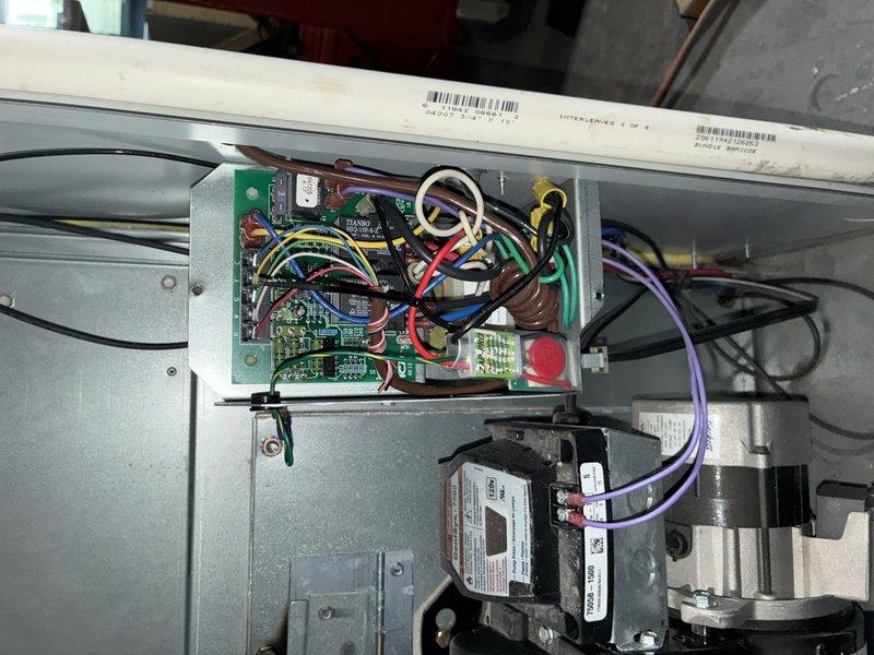 Completed annual MVP cooling maintenance visit on 1-year-old HVAC system. Removed access panels to inspect control board, electrical connections, and blower motor assembly. Verified all wiring connections secure with proper color-coded routing throughout control section. Inspected transformer, circuit boards, and motor components for proper operation and wear patterns. All components functioning within normal parameters with minimal dust accumulation consistent with system age.