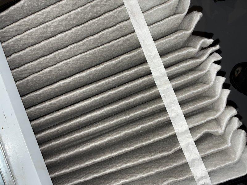 Completed MVP cooling maintenance visit on residential HVAC system. Inspected and documented air filter condition, which showed moderate dust accumulation across pleated media but maintained structural integrity. Examined blower wheel assembly and verified operational condition, noting normal dust buildup on blades consistent with regular system usage.