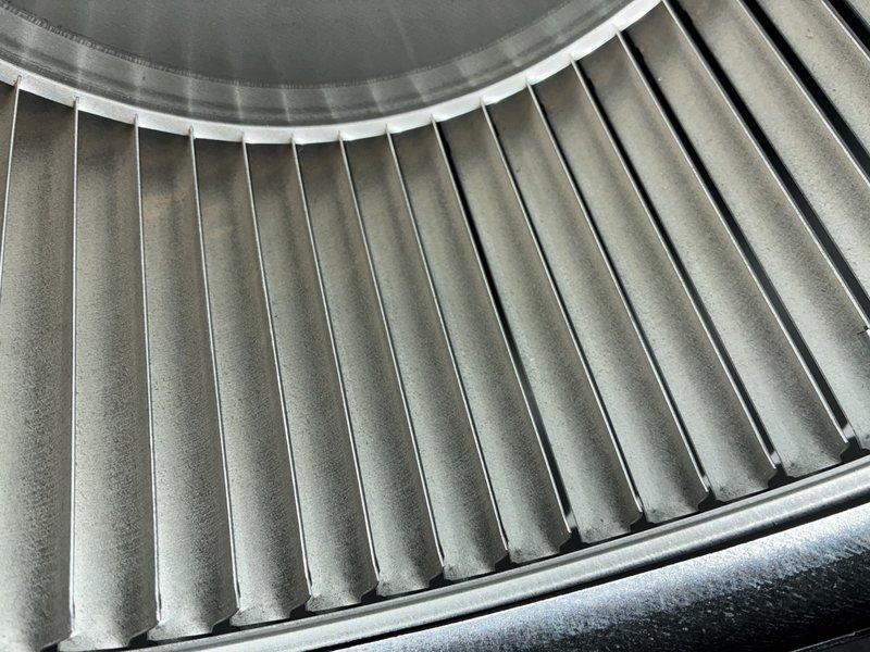 Completed MVP cooling maintenance visit on residential HVAC system. Inspected and documented air filter condition, which showed moderate dust accumulation across pleated media but maintained structural integrity. Examined blower wheel assembly and verified operational condition, noting normal dust buildup on blades consistent with regular system usage.