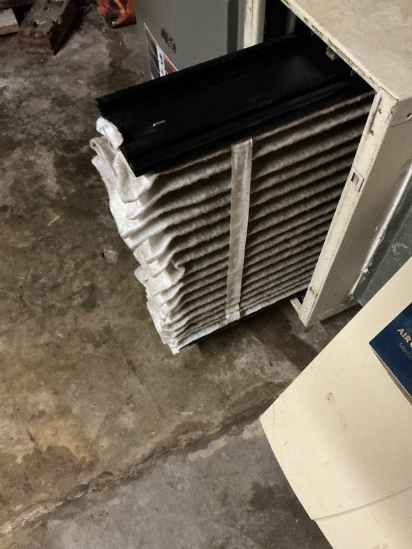 # HVAC Maintenance - Cooling

Completed comprehensive MVP cooling maintenance visit on residential Lennox air conditioning system. Performed thorough inspection of outdoor condenser unit and indoor evaporator coil assembly. Indoor coil exhibited significant accumulation of dirt and dust throughout aluminum fin array, restricting airflow and reducing heat exchange efficiency. Opened access panels on evaporator unit to assess coil condition and document maintenance needs through photographic documentation.

Inspected outdoor condenser unit positioned on ground-level pad adjacent to structure. Unit surrounded by vegetation, mulch, and debris requiring clearance maintenance. Verified proper clearance around condenser housing and assessed fin condition on exterior heat exchanger. Documented equipment location, surrounding conditions, and accessibility for ongoing maintenance requirements.

System operational at time of inspection. Maintenance visit completed per MVP recurring service agreem