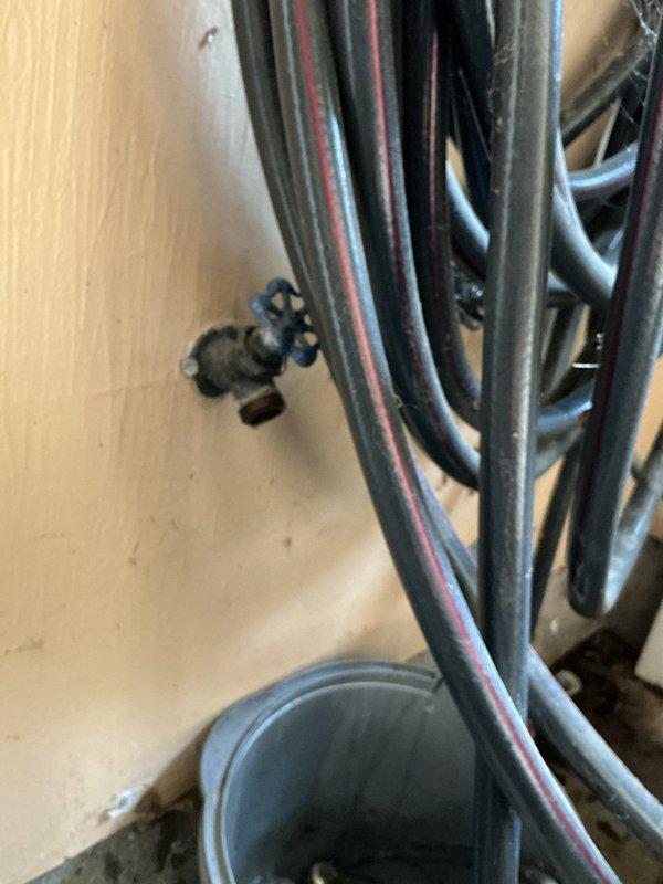 Responded to service call for multiple plumbing issues including garage faucet leak, malfunctioning toilet, and water heater concerns servicing the master bathroom. Inspected toilet tank and identified deteriorated internal components with significant mineral buildup and sediment accumulation on flush valve and fill valve assembly; flapper showed wear and discoloration from hard water deposits. Assessed water heater condition and examined associated plumbing connections and supply lines. Documented all findings with photographs for customer records and provided recommendations for necessary repairs including toilet tank component replacement to restore proper flushing operation.