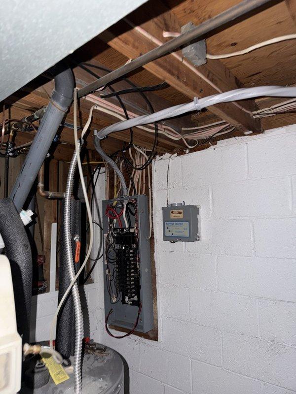 Replaced existing electrical service and disconnect with new 200-amp meter base and disconnect combination unit. Upgraded undersized #2 service conductors from disconnect to main panel with proper 4/0 aluminum wire to meet current code requirements. Updated and corrected all grounding systems throughout the residence to ensure proper electrical safety and code compliance.