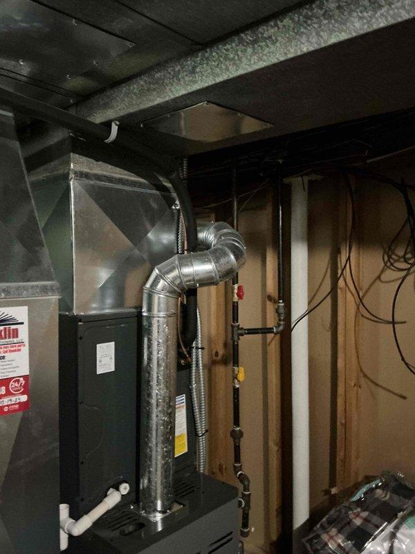 Completed MVP recurring cooling maintenance visit on a 5-year-old system. Performed comprehensive inspection of HVAC equipment including furnace, air handler, and associated ductwork in basement utility area. Verified proper operation of all mechanical components, checked refrigerant lines, inspected aluminum flexible ductwork connections, and confirmed system integrity. All equipment found operating within normal parameters with no immediate repairs required.