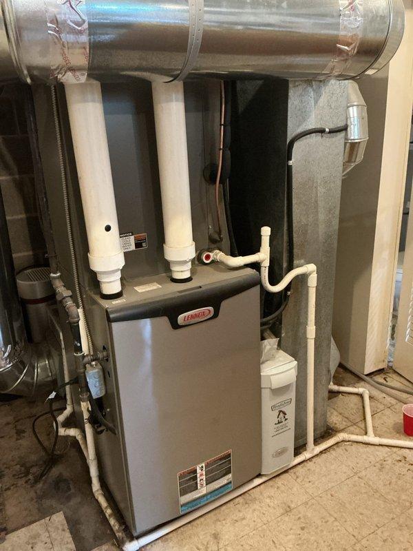 Completed preventive maintenance on 6-year-old Lennox air conditioning system. Performed comprehensive tune-up including inspection of outdoor condenser unit and indoor air handler, verified proper refrigerant levels via copper line set, checked electrical connections at disconnect box, cleaned condenser coils, inspected fan operation, tested system controls, and verified proper drainage through PVC condensate lines. Noted vegetation growth around outdoor unit and recommended clearance maintenance for optimal airflow and efficiency. All components operating within manufacturer specifications upon completion.