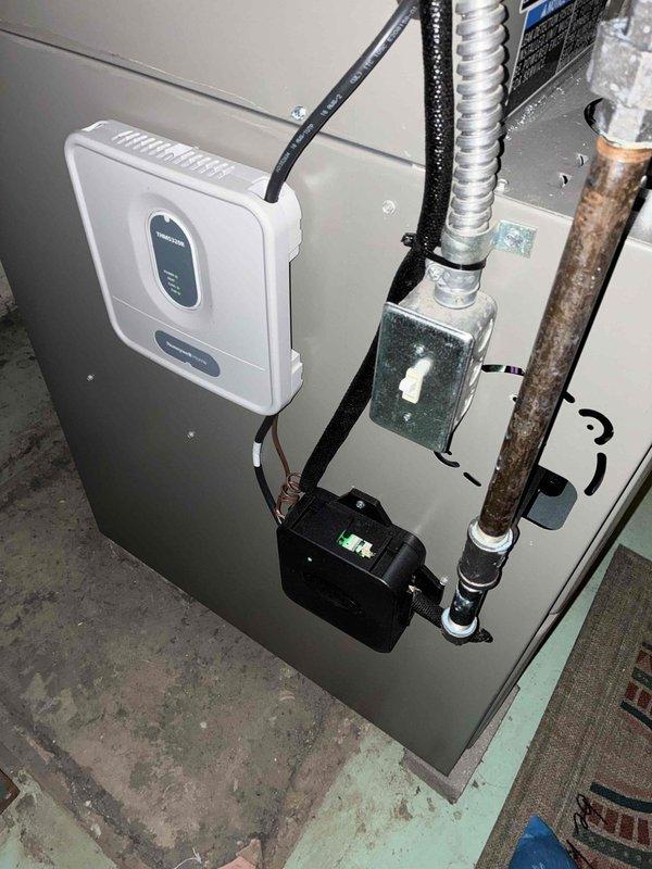 Completed MVP cooling maintenance visit on residential HVAC system. Performed comprehensive inspection of indoor air handler unit and outdoor condensing unit, documenting equipment condition through photos. Inspected electrical control panel, capacitor, and all associated wiring connections for proper operation. Noted copper refrigerant line showing surface oxidation and corrosion on vertical run near air handler cabinet. All electrical components, including digital controller with green indicator lights, operating within normal parameters. System tested and confirmed operational at completion of maintenance visit.