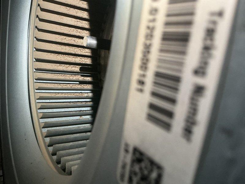 Completed comprehensive air conditioning tune-up service including inspection of electrical control panel, wiring connections, and capacitor. Observed dust accumulation on ventilation components and interior surfaces; all electrical connections verified secure and system operational.