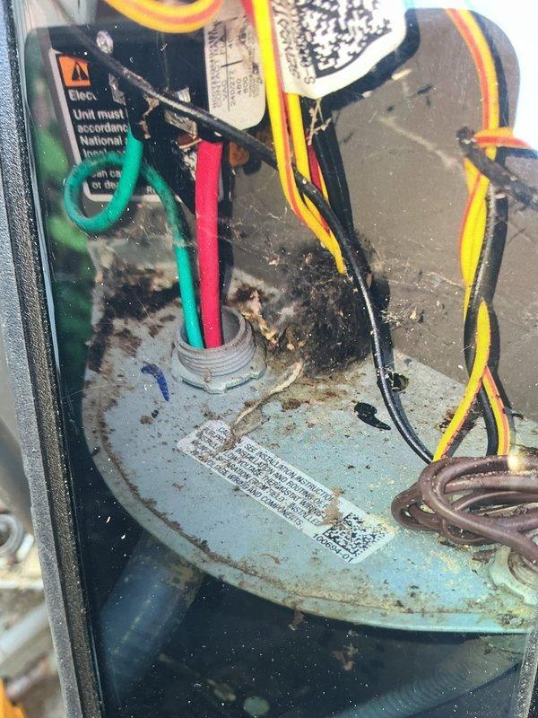 Completed preventive maintenance visit on 7-year-old air conditioning system for MVP customer. Inspection revealed heavily soiled evaporator coil with significant dirt and debris accumulation on fins, as well as condensate buildup and corrosion on compressor housing and electrical connections. Documented equipment condition with photographs showing deteriorated state of critical components requiring attention for optimal system performance and longevity.
