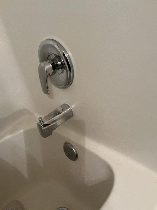 Successfully completed a comprehensive plumbing upgrade involving multiple fixture replacements throughout the residence. Replaced the shower valve in the upstairs hallway bathroom with a new single-handle chrome control valve, ensuring proper water flow and temperature regulation. Installed a new tub spout with diverter mechanism to complement the valve replacement.

Installed a new water softener system, including all necessary tubing and connections to integrate with the existing plumbing infrastructure. Staged and positioned the softener unit for optimal performance and accessibility for future maintenance.

Replaced the kitchen faucet with a new fixture, ensuring proper seal and connection to supply lines. Additionally, replaced the bathroom vanity faucet with a chrome two-handle unit, verifying proper installation on the speckled gray laminate countertop with white oval drop-in sink.

All fixtures were tested for proper operation, water pressure, and leak-free connections. The in
