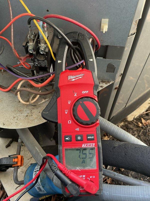 Completed MVP cooling maintenance visit on 8-year-old system. Performed electrical diagnostics using digital clamp meter, recording amperage readings of 0.58A and 755A at various system components. Inspected outdoor unit's electrical panel, contactor assembly, and wire connections. Verified proper operation of all electrical components including control circuits and power connections. System tested and operating within normal parameters.