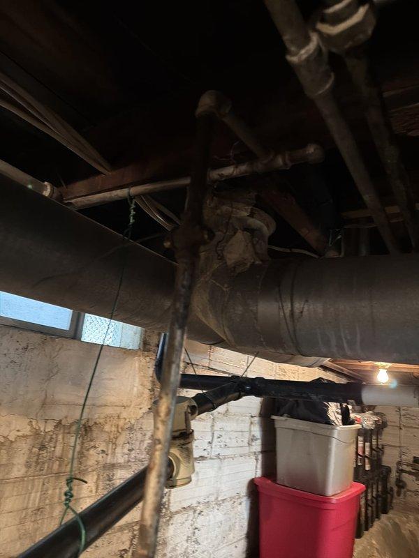 Successfully installed a 40-gallon hot water heater in the basement utility area. The installation included connecting copper supply lines with brass fittings and a red-handled ball valve for system isolation. All necessary parts from the water heater kit were utilized during the installation, and the unit was properly positioned and secured within the existing plumbing infrastructure alongside the HVAC ductwork system.
