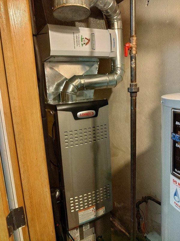 # HVAC Install - Complete System

Completed installation of a new 80% efficiency furnace and air conditioning system at residential property. Installed Lennox furnace unit with integrated humidifier system in utility closet, including all necessary ductwork connections with both rigid and flexible metallic piping. Configured copper plumbing lines with shutoff valves for proper water supply integration to humidifier component.

Installed complete air conditioning system with outdoor condenser unit. Performed system startup and commissioning procedures, including refrigerant charging and pressure testing using digital manifold gauges. Verified system pressures and temperatures across all refrigerant lines, with readings confirming proper charge levels and optimal system performance. Connected refrigerant lines to both indoor and outdoor units with appropriate insulation and secure fittings.

Integrated all electrical connections for furnace, air conditioning, and humidifier components pe