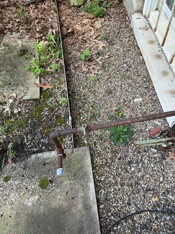 Conducted electrical estimate for generator installation serving a portion of the building. Assessed existing site conditions including weathered exterior infrastructure with rusted metal conduit, concrete foundation areas showing environmental wear, and gravel pathways with vegetation growth. Evaluated interior electrical distribution system with extensive bundled cable routing across tiled work area. Documented existing conditions through photographic survey to support generator sizing, load calculations, and electrical connection requirements for estimate development.