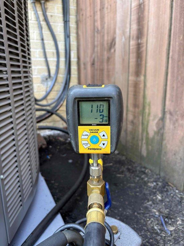 Completed full HVAC system installation including new air handler and condensing unit. Evacuated refrigerant lines to proper vacuum levels using digital micron gauge, confirming system achieved below 500 microns for moisture removal. Verified electrical connections and replaced dual 35-amp time-delay fuses in outdoor disconnect, ensuring proper overcurrent protection for the new equipment.