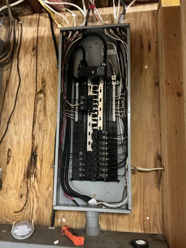 Relocated AC circuit for one of two air conditioning units at the property. Ran new electrical wiring from the main panel through exposed framing and attic space, installing junction boxes and securing cable runs with proper mounting hardware. Modified circuit breaker connections in the electrical panel to accommodate the relocated unit, ensuring all connections met code requirements for proper wire routing and strain relief.