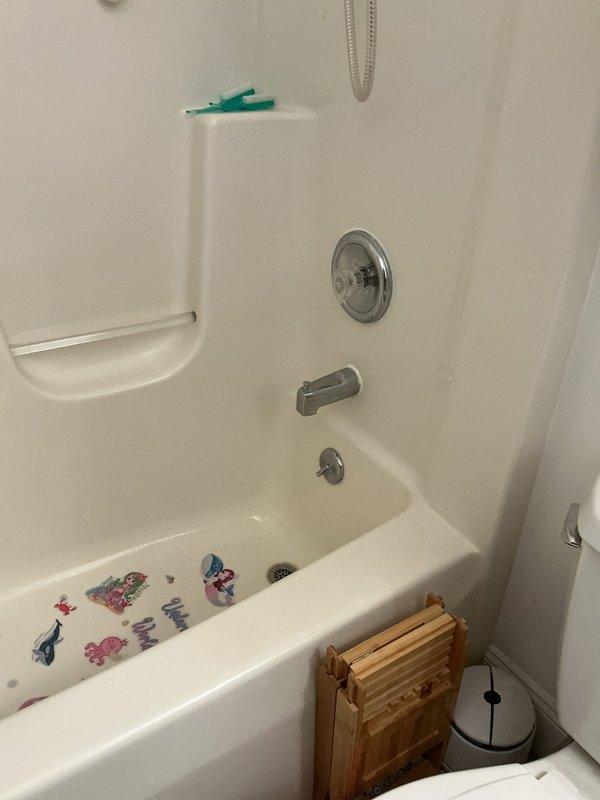 Responded to multiple plumbing concerns at a 31-year-old residential property. Addressed high water pressure issue causing loud squealing noise in pipes by adjusting pressure regulator to manufacturer specifications. Replaced deteriorated drain trap assembly under utility sink with new P-trap and tailpiece components, ensuring proper seal and drainage. Performed mechanical snaking of bathtub drain to remove hair and debris buildup, restoring proper water flow. All fixtures tested and confirmed operational upon completion.