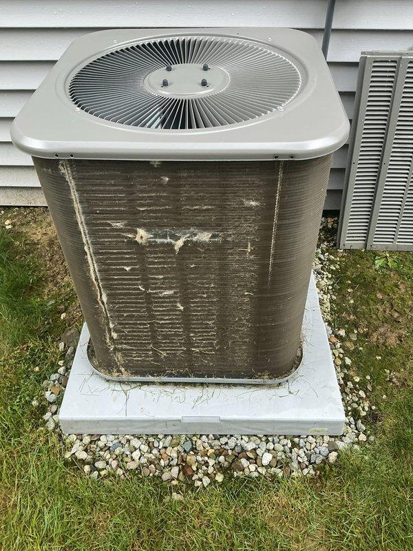 Completed MVP recurring cooling maintenance visit on Lennox air conditioning system. Upon arrival, noted significant dirt accumulation, grime buildup, and discoloration on condenser unit exterior panels and heat exchange fins, with visible streaking patterns and possible mold growth indicating extended exposure to environmental elements. Performed standard preventive maintenance procedures including system inspection and documentation with photographs of unit condition and manufacturer specifications label for service records.
