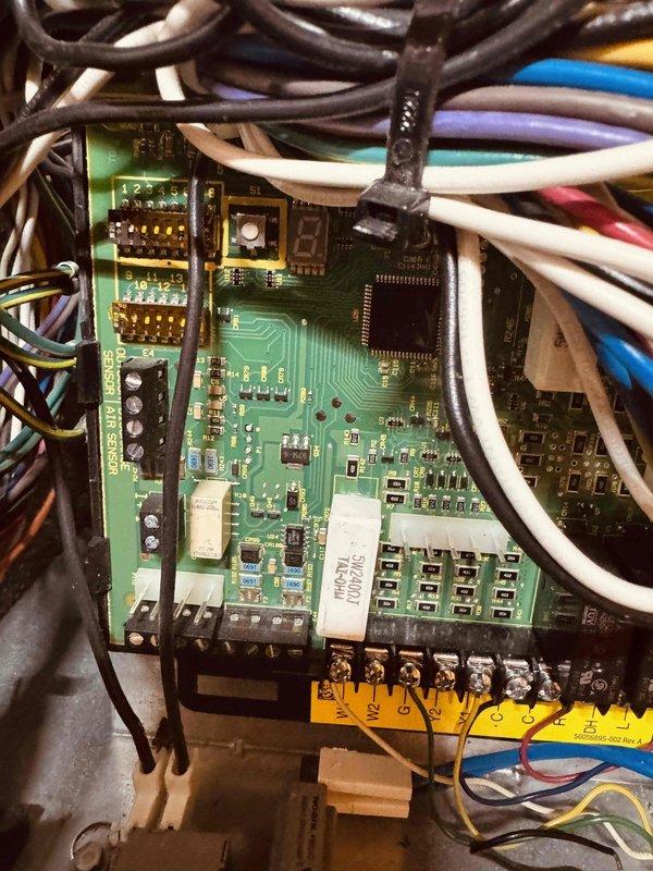 Replaced malfunctioning M30 thermostat with new unit. Completed proper wiring connections to terminal block including all HVAC control wires (heating, cooling, and reversing valve circuits) and verified secure terminations at both the thermostat and control board. System tested and operational upon completion.