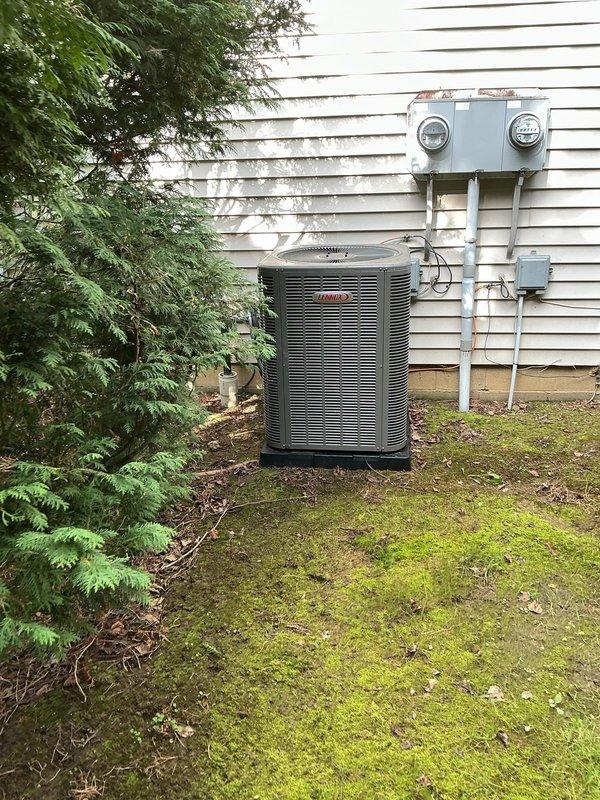 Responded to service call for non-operational air conditioning system on one-year-old Lennox condenser unit. Upon arrival, performed diagnostic inspection of outdoor unit including visual assessment of electrical components and fuse array. Inspected dual-fuse configuration with copper and color-coded caps, verified electrical connections, and assessed overall system condition. Unit found to be in operational status following inspection, with all major components including fan assembly and electrical panel functioning properly.