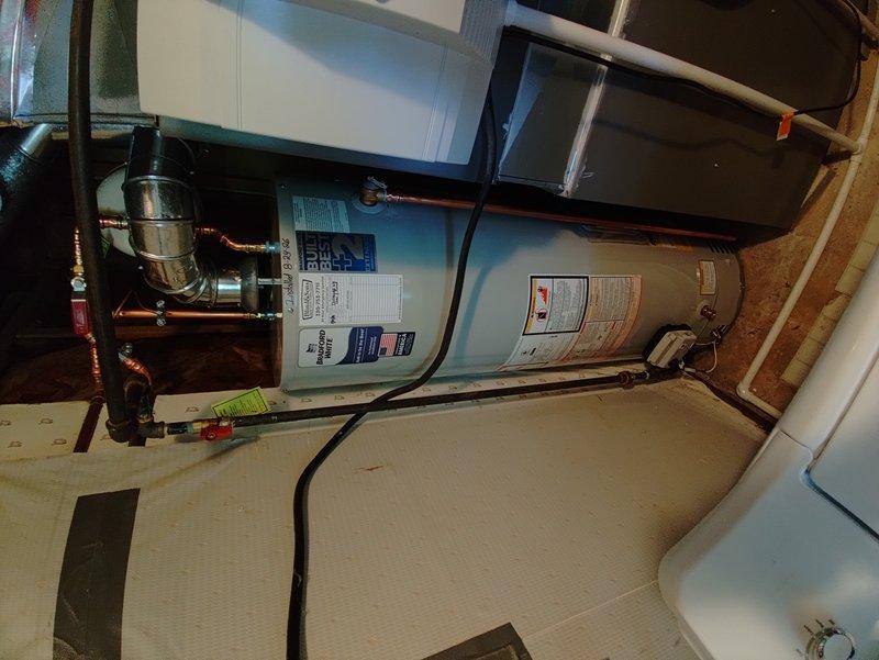 Replaced 1-inch main water shut-off valve inside the home and installed code-approved frost-free hose bib in place of existing boiler drain. Removed existing Bradford White water heater and installed new Bradford White unit with all necessary copper piping connections and water heater installation kit. Installation included new thermal expansion tank to meet current plumbing code requirements.
