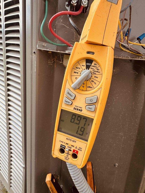 Completed MVP cooling maintenance visit on 6-year-old system that was rescheduled from previous date. Performed diagnostic testing using multimeter to verify electrical parameters and system operation, documenting readings and inspecting ductwork and ceiling-mounted HVAC components throughout accessible areas.