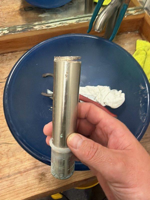 Responded to commercial plumbing service call for sink drainage issues. Upon diagnostic inspection, identified failed seal and split threads on drain piping assembly beneath sink fixture. Removed damaged piping components, applied appropriate sealant compound, and replaced defective drain assembly with new threaded connections. Documented existing conditions and completed repairs to restore proper drainage function. Multiple sink stations inspected to ensure all plumbing fixtures were operational and secure.