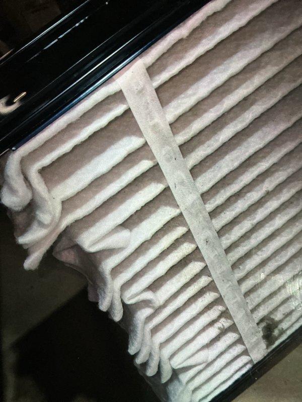 Completed routine maintenance visit on a 3-year-old air conditioning system under MVP recurring service agreement. Upon inspection, discovered heavy frost and ice buildup on the evaporator coil, indicating restricted airflow or possible refrigerant issue. Documented refrigerant line set condition in mechanical space, noting proper insulation and secure bundling of copper tubing with appropriate fasteners against concrete block wall.