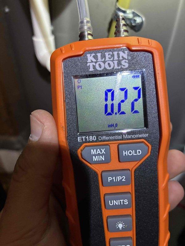 Completed routine maintenance on 5-year-old air conditioning system. Performed system diagnostics including pressure differential measurements across filter media registering 0.22 inches of water column and verified supply air temperature at 54°F. All operational parameters found within normal specifications and system confirmed operating properly.