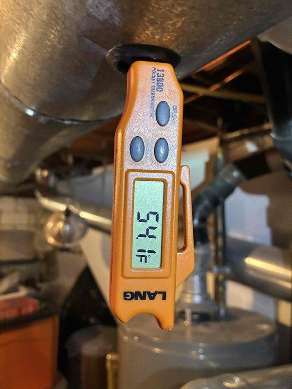 Completed routine maintenance on 5-year-old air conditioning system. Performed system diagnostics including pressure differential measurements across filter media registering 0.22 inches of water column and verified supply air temperature at 54°F. All operational parameters found within normal specifications and system confirmed operating properly.