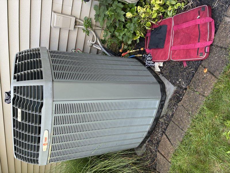 Completed routine maintenance cooling visit on 14-year-old residential outdoor condensing unit. Performed standard inspection of equipment components, verified operational status, and documented unit condition with photographs showing proper installation on concrete pad with adequate clearance from surrounding vegetation and fence line. Unit operating within normal parameters at time of service.