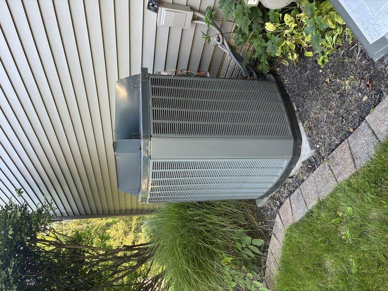 Completed routine maintenance cooling visit on 14-year-old residential outdoor condensing unit. Performed standard inspection of equipment components, verified operational status, and documented unit condition with photographs showing proper installation on concrete pad with adequate clearance from surrounding vegetation and fence line. Unit operating within normal parameters at time of service.