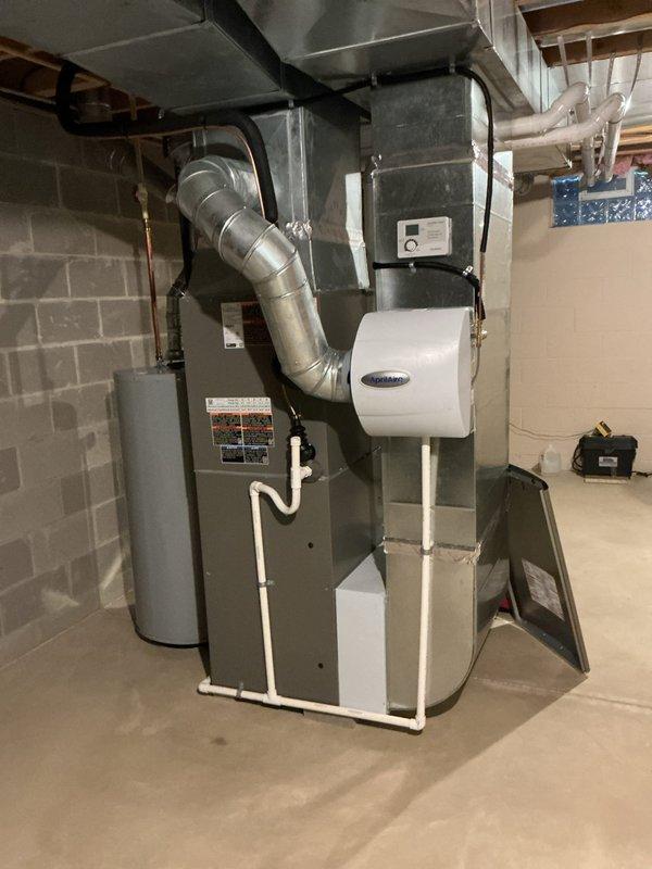 Completed first-year maintenance checkup on residential cooling system installed last August. Performed comprehensive inspection of indoor furnace unit, humidifier, and outdoor condenser unit, verifying all components are operating within manufacturer specifications. System found in excellent condition with no issues identified; all equipment functioning properly for continued seasonal operation.
